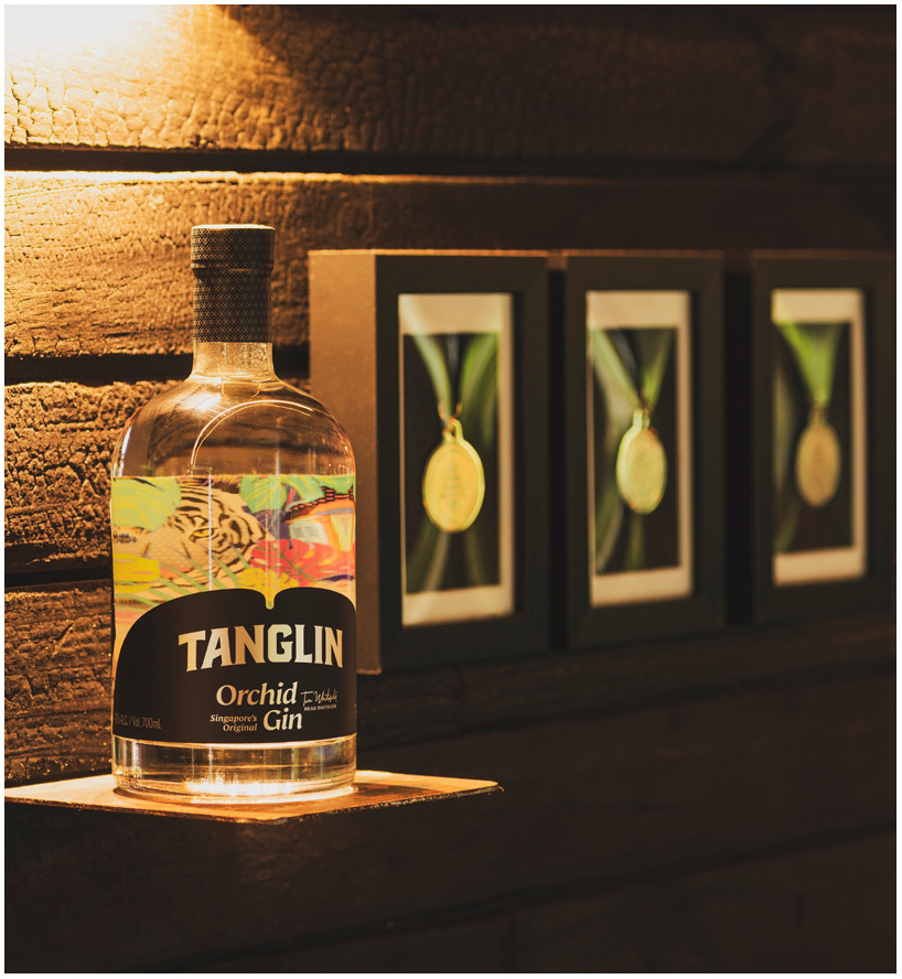 Tanglin Orchid Gin bottle beside its award medals